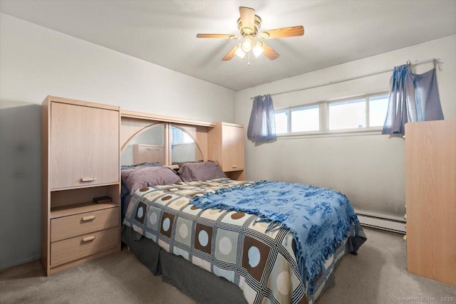 carpeted bedroom with ceiling fan and a baseboard heating unit