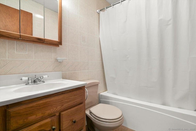 full bathroom featuring tasteful backsplash, tile walls, vanity, toilet, and shower / bath combo with shower curtain