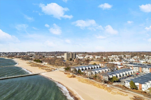 bird's eye view featuring a view of the beach and a water view