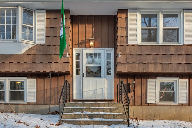 view of snow covered property entrance