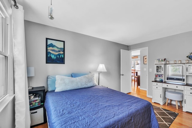 bedroom featuring light wood-type flooring