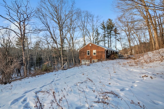 view of yard layered in snow