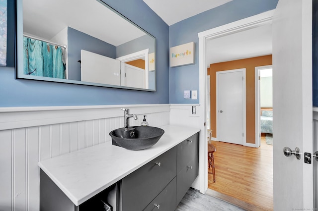 bathroom featuring vanity and wood-type flooring