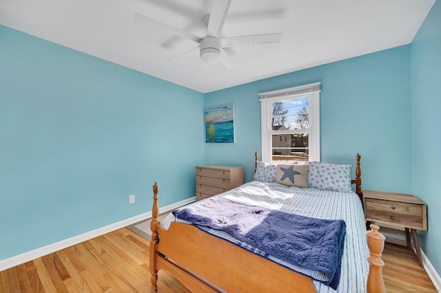 bedroom featuring wood-type flooring and ceiling fan