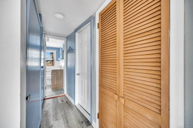 hall with light hardwood / wood-style flooring