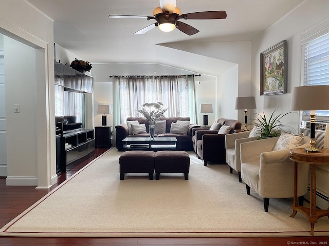 living room with ceiling fan, vaulted ceiling, dark wood-type flooring, and baseboard heating