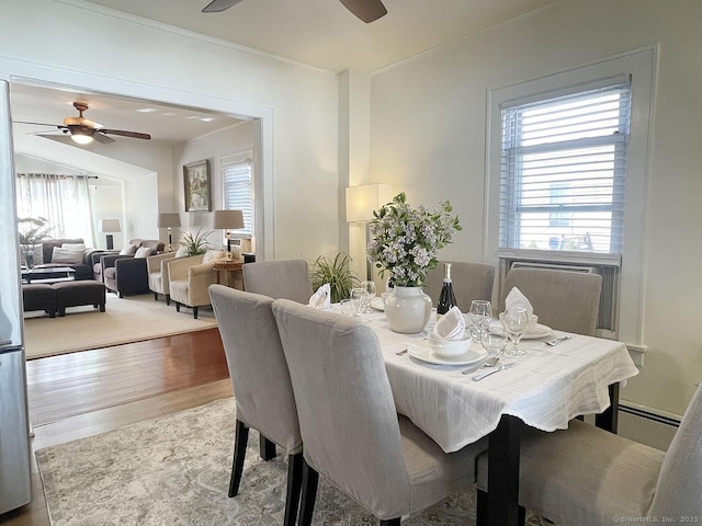 dining area with hardwood / wood-style floors, a healthy amount of sunlight, and ceiling fan