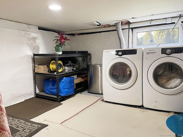 laundry area with washing machine and dryer