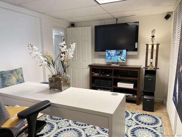 office area featuring a paneled ceiling and light tile patterned floors