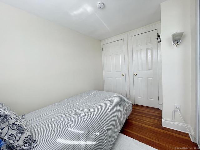 bedroom featuring dark hardwood / wood-style flooring