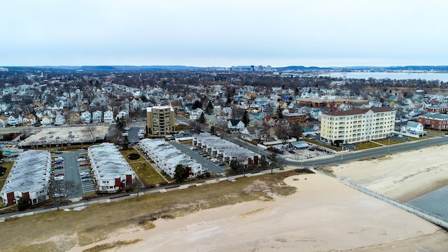 bird's eye view with a water view and a beach view