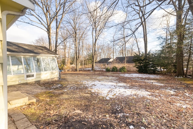 view of yard with a sunroom