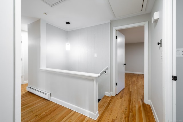 corridor featuring hardwood / wood-style flooring and a baseboard radiator