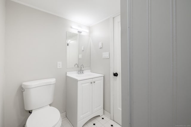 bathroom with vanity, tile patterned floors, and toilet