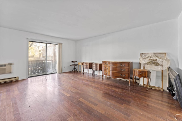 interior space with a wall mounted air conditioner and dark wood-type flooring