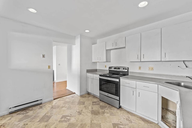 kitchen with sink, stainless steel electric range, a baseboard radiator, and white cabinets