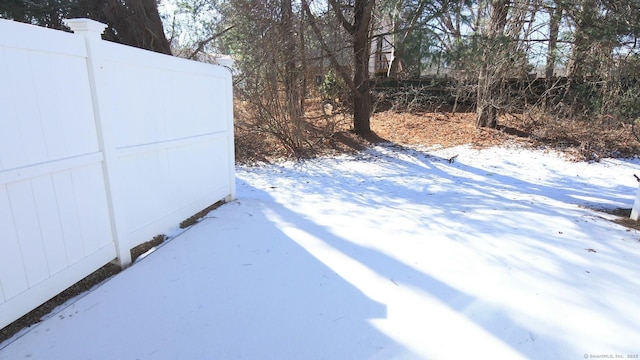 view of yard layered in snow