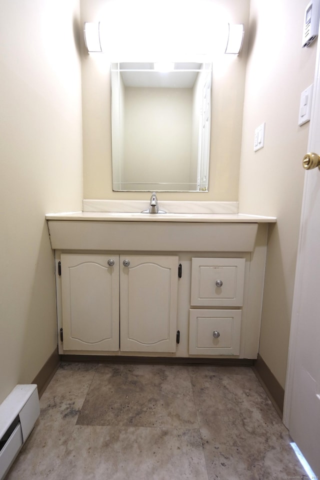 bathroom featuring vanity and baseboard heating