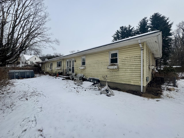 view of snow covered house