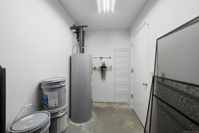 utility room with electric water heater