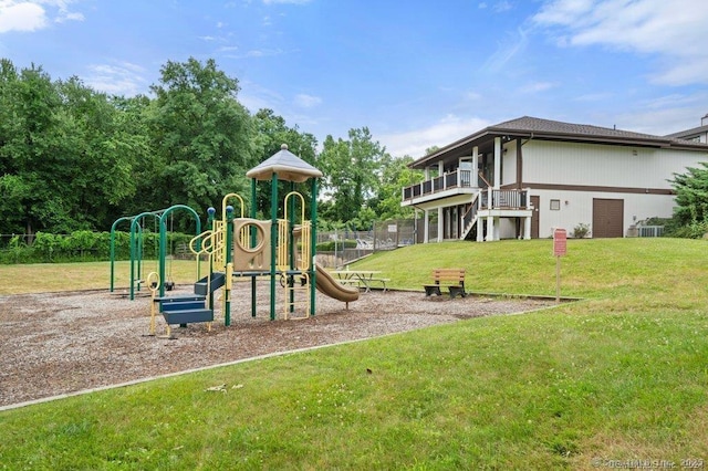 view of jungle gym featuring central AC unit and a lawn