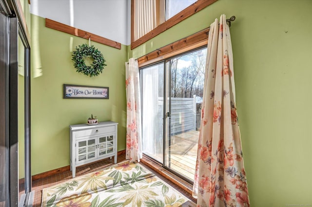 entryway with a towering ceiling