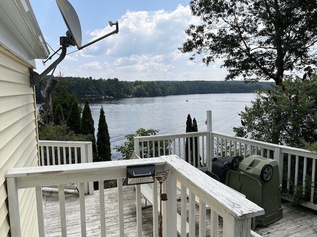 wooden terrace with a water view