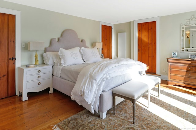 bedroom featuring dark hardwood / wood-style flooring