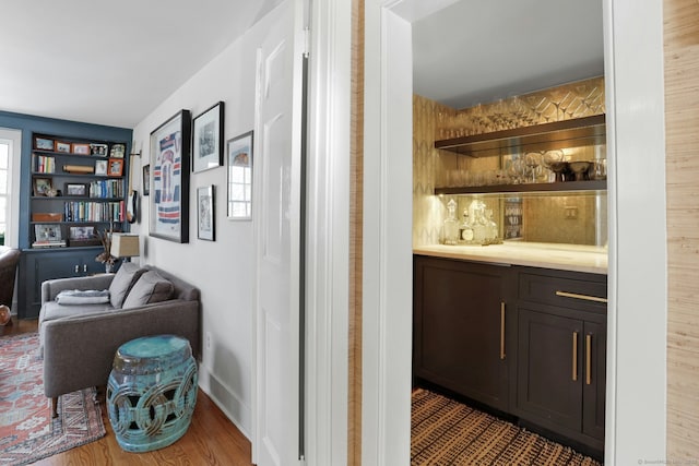 interior space with wood-type flooring and dark brown cabinets