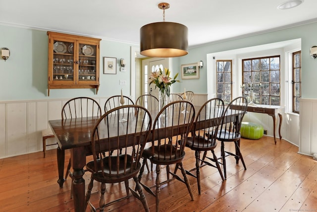 dining room featuring crown molding and wood-type flooring