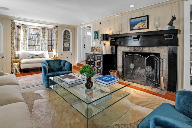 living room featuring crown molding and wood-type flooring