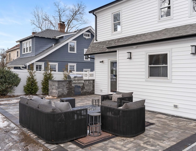 exterior space featuring an outdoor living space, a patio, and area for grilling