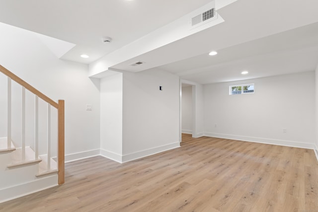 basement featuring light wood-type flooring