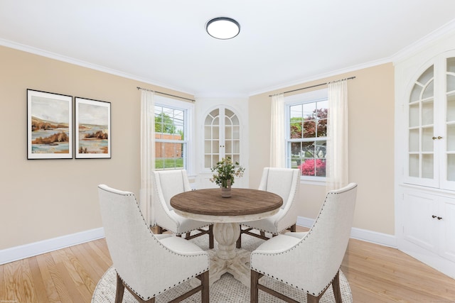 57 Saint James St, West Hartford, CT 06119 - dining room with light wood finished floors, baseboards, and ornamental molding