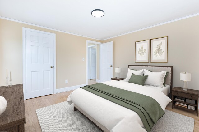 57 Saint James St, West Hartford, CT 06119 - bedroom with light wood-type flooring, crown molding, and baseboards