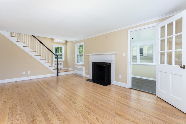 57 Saint James St, West Hartford, CT 06119 - unfurnished living room featuring stairway, radiator, light wood-style floors, baseboards, and ornamental molding