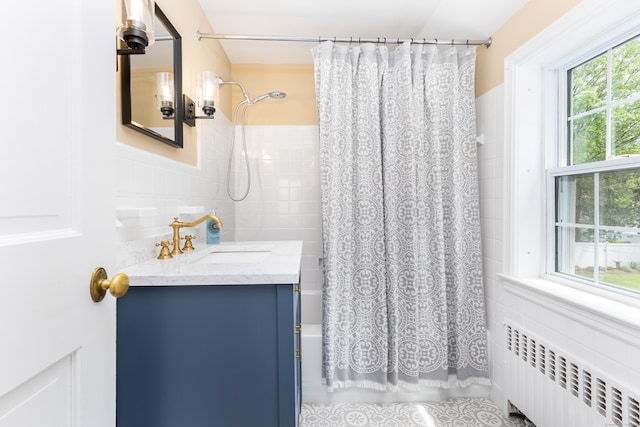 57 Saint James St, West Hartford, CT 06119 - full bathroom with radiator, tile walls, shower / bathtub combination with curtain, vanity, and a wainscoted wall