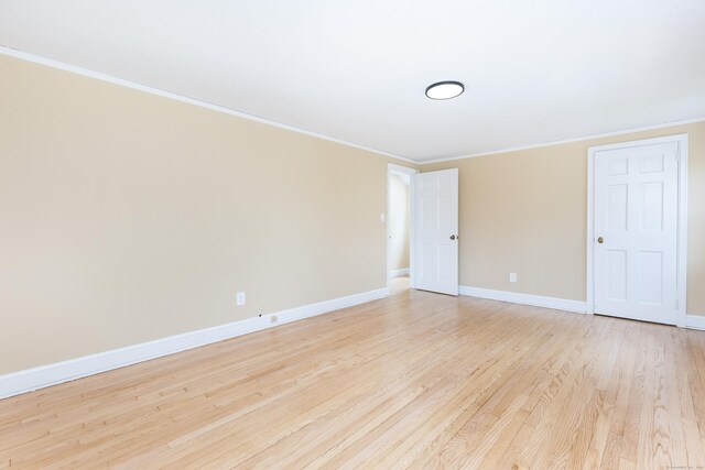 57 Saint James St, West Hartford, CT 06119 - spare room with crown molding, baseboards, and light wood finished floors