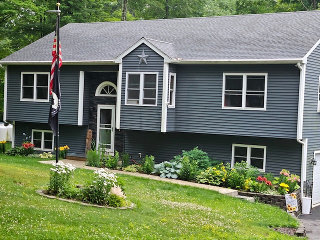 bi-level home with a front yard