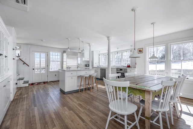 dining area with dark wood-style floors and visible vents