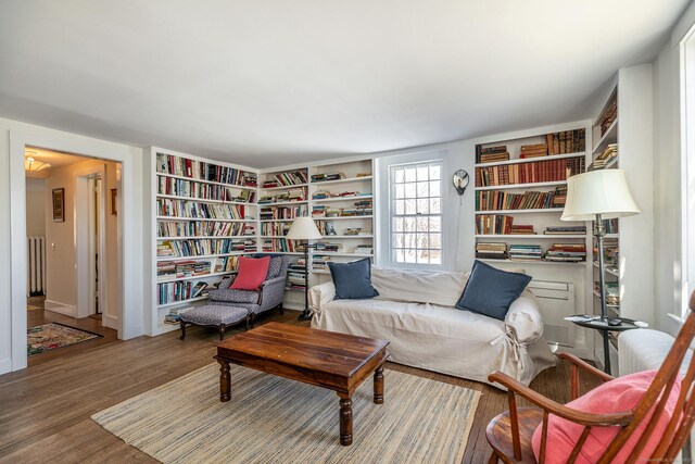 9 Mallory Brook Rd, Washington, CT 06793 - living area featuring wood finished floors, built in features, and baseboards