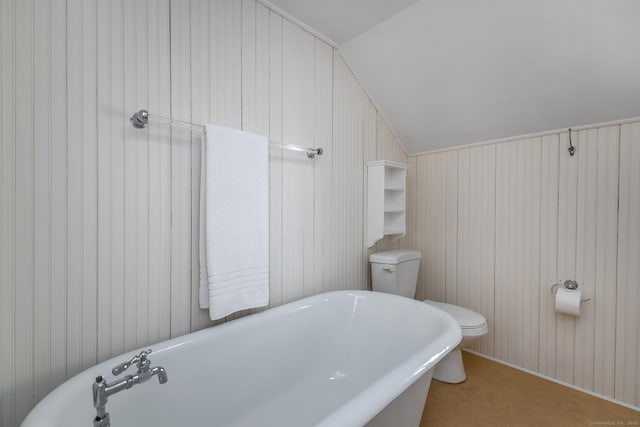 9 Mallory Brook Rd, Washington, CT 06793 - bathroom with a freestanding bath, lofted ceiling, toilet, and wooden walls