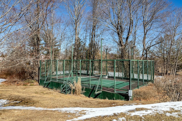 view of sport court with fence