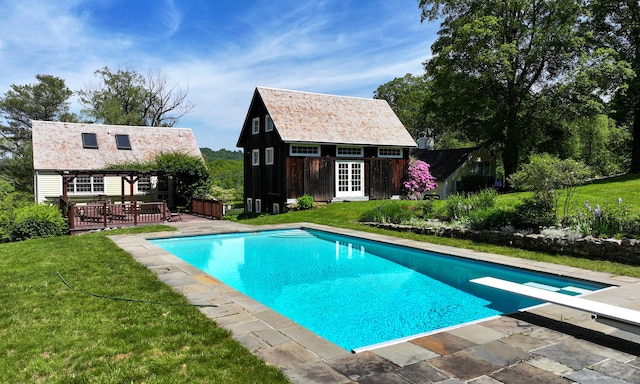 9 Mallory Brook Rd, Washington, CT 06793 - outdoor pool featuring an exterior structure, an outdoor structure, a lawn, a diving board, and a wooden deck