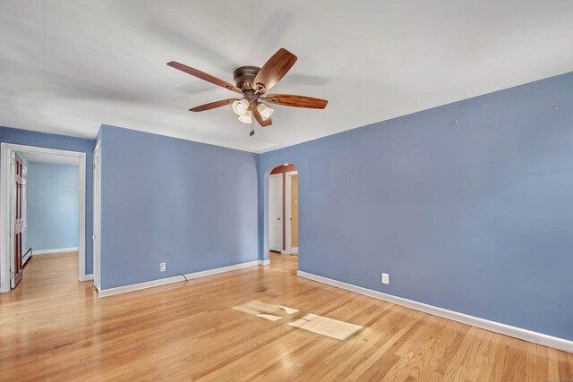 unfurnished room with ceiling fan and light hardwood / wood-style flooring