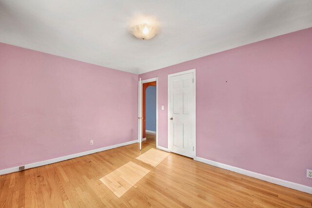 unfurnished bedroom featuring light wood-type flooring