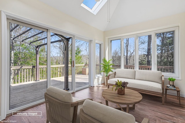 sunroom / solarium with lofted ceiling with skylight