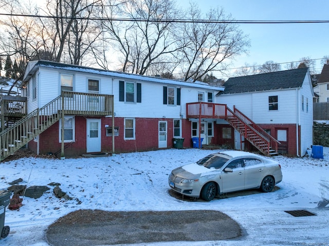 view of front of property featuring a wooden deck