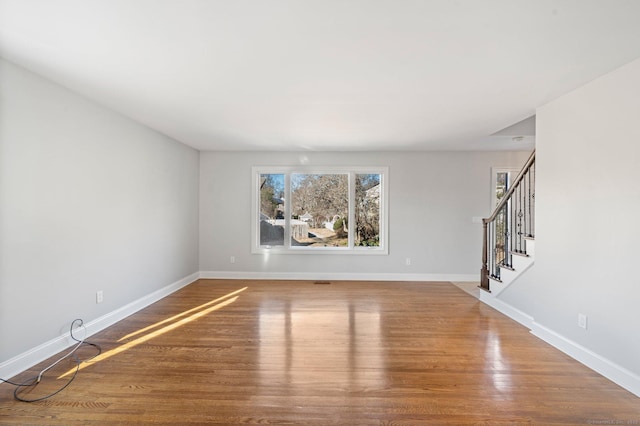 empty room featuring wood-type flooring