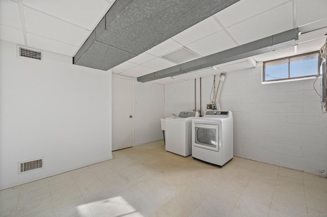 laundry area featuring washing machine and clothes dryer